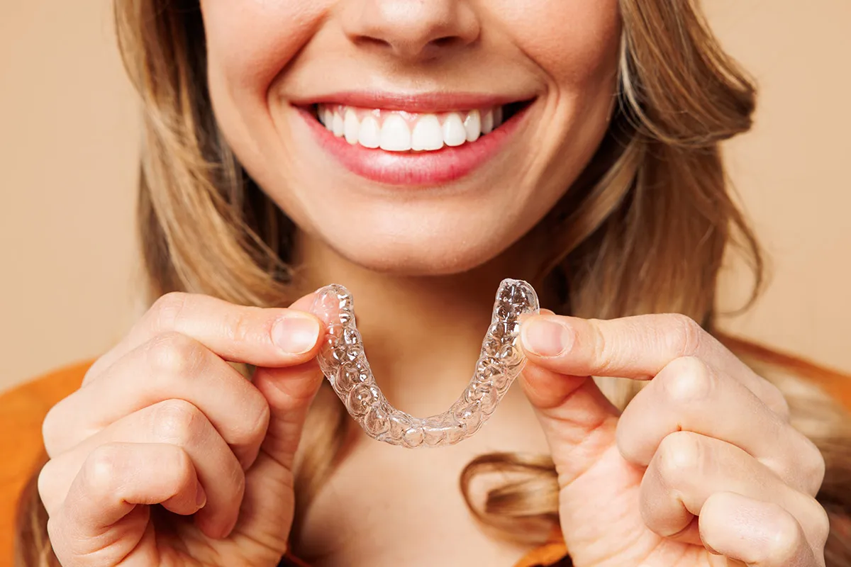 Close-up of a smile and a clear aligner tray