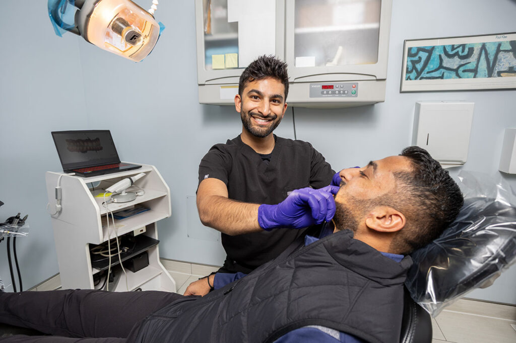 Dr. Patel Fitting Snap-in Dentures in Chicago